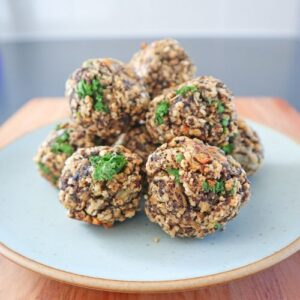 vegetarian meatballs stacked over seafoam plate