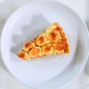 Argentinian tart with dulce de leche filling and golden coconut topping