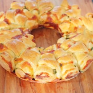 round cheese stuffed bread on chopping board.