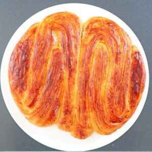 Soft and fluffy homemade sweet bread on round serving plate