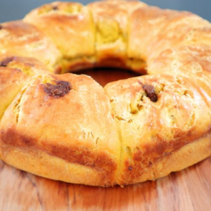 round soft bread on a wooden board