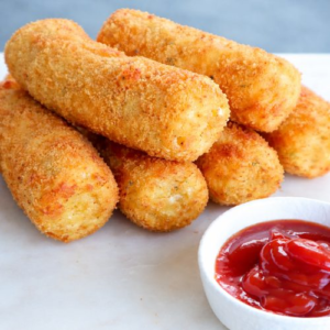 Crispy golden potato croquettes served with ketchup