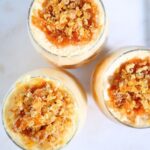 Caramelized bread dessert cups with butterscotch cream and crunchy nut topping view from top